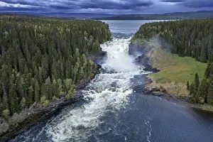 Aerials: Aerial view over the Tannforsen falls in spring near Are on the Indalsalven River