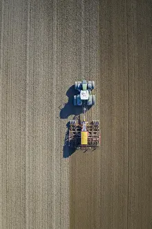 Tractor: Aerial view over tractor with pneumatic seed drill