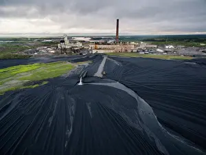Scrap: Aerial view of vast field of black slag surrounding