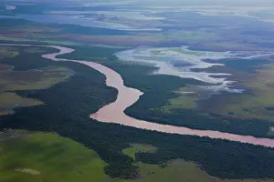 Lowlands: Aerial of winding river and tree savannah