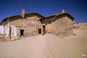 Encroachment: Africa - desert encroachment. Derelict diamond mining town