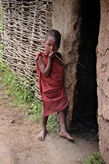 Tribal: Africa, Kenya, Maasai Mara. A young child