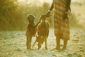 Farmers: AFRICA - MAASAI PEOPLE, woman with baby and goats