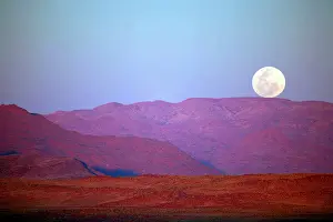 Foothill: Africa, Namibia, Sossusvlei. A full moon
