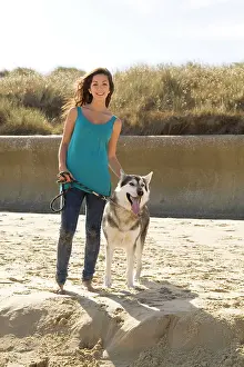 Malamute: Alaskan Malumute (cross) dog - with teenage girl