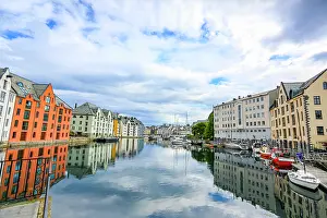 Canal: Alesund, Norway. Colorful painted buildings and marina