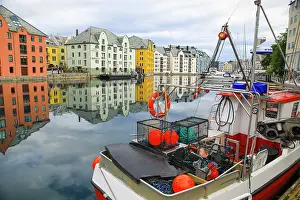 Canal: Alesund, Norway. Fishing boat and canal water reflection