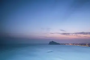 Sergio Arias: Altea coastal scene with night lights by Mediterranean