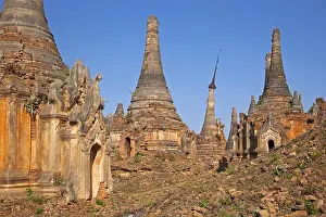Burmese: Ancient red brick Buddhist stupas near the village I