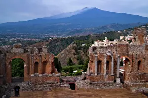 Sicily: Ancient theatre, Teatro Greco, behind volcano Etna