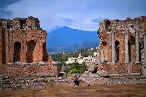 Sicily: Ancient theatre, Teatro Greco, behind volcano Etna