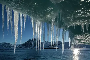 Pointed: Antarctica, Icicle hangs from melting iceberg