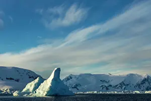 Enterprise: Antarctica, Morning sun lights iceberg floating