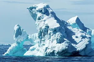 Arched: Antarctica, Sunshine lights arched iceberg