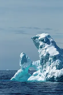 Arched: Antarctica, Sunshine lights arched iceberg