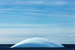 Gerlache: Antarctica, Sunshine lights rounded iceberg