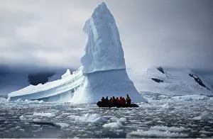 Seascapes: ANTARCTICA - Tourists in zodiac boat and icebergs