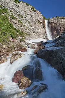 Snowmelt: Apikuni Falls with snow melt runoff in Glacier