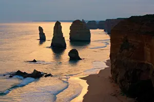 Twelve: Twelve Apostles sunset - setting sun over the sandstone