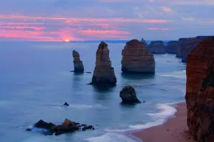 Twelve: Twelve Apostles sunset - setting sun over the sandstone