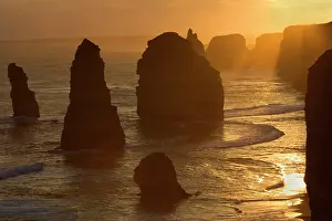 Twelve: Twelve Apostles sunset - setting sun over the sandstone