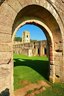 Dilapidated: Arched doorway into Fountains Abbey, founded in