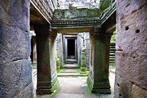 Secret: Arched walkways and pillars in the ruins of the Bayon Kh