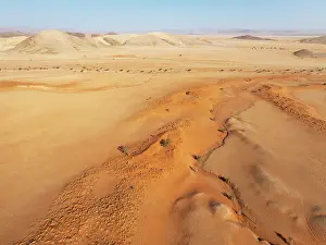 Eroded: Arid plains grown with camelthorn trees (Vachellia erioloba)