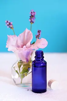 Containers: Aromatherapy oil, lavender, flower, towel