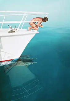 Frontalis: Atlantic spotted DOLPHIN - bow riding a boat. Girl on boat