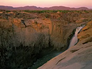 Cascading: Augrabis Falls - orange river cascading down deep canyon