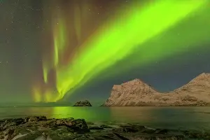 Starry: Aurora borealis - northern lights display lights up a starry