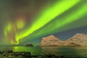 Starry: Aurora borealis - northern lights display lights up a starry