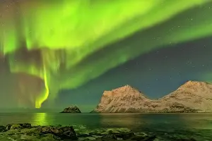 Starry: Aurora borealis - northern lights display lights up a starry