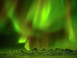 Forecast: Aurora Borealis, Northern Lights over Snowy Mountains