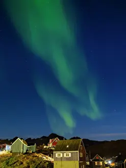 Settlement: Aurora over the town. Town Tasiilaq (former Ammassalik), the