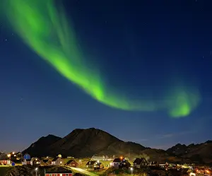 Settlement: Aurora over the town. Town Tasiilaq (former Ammassalik), the