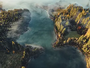 Halblech: Autumn sunrise in the foothills of the Alps with fog at Illasbergsee and Forggensee near Halblech in Allgau