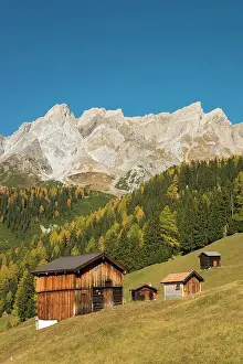 Huts: Autumnal mountain landscape with alpine huts, behind