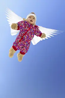 Everyday: Baby girl with wings, flying angel. model released