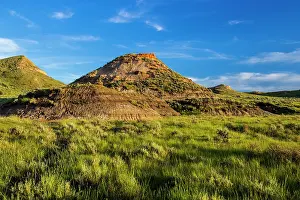 Jordan: Badland formations in short grass prairie