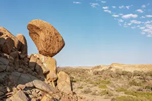 Balancing: Balancing rock high above the dry bed of the Ugab river. Aer