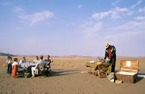Tourists: Balloon Safari - after landing in a true desert