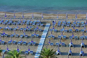 Chairs: Beach chairs and umbrellas on the beach at Vietri