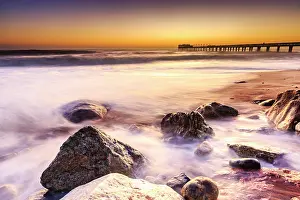 Namibian: Beach at a former pier, jetty at sunset, Atlantic