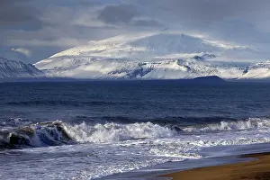 Stratovolcano: Beach with surf and the volcano and glacier Sn~fellsjnkull