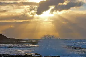 Breaking: Beams of sunlight breaking through the clouds