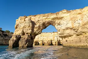 Algarve: Beautiful rock and cliff coast under a brigh blue