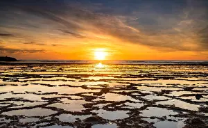 Alentejo: A beautiful sunset over the ocean with rocky beach
