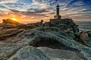 Reflex: A beautiful sunset at the Punta Nariga lighthouse in Galicia